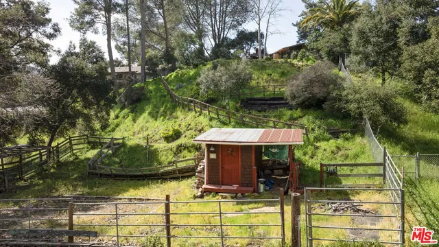 a front view of a house with outdoor seating