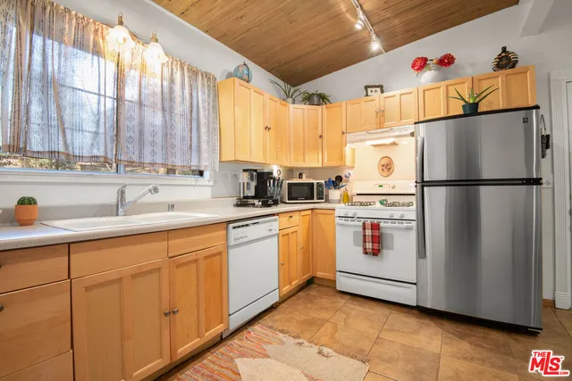 a bedroom with a bed and a table