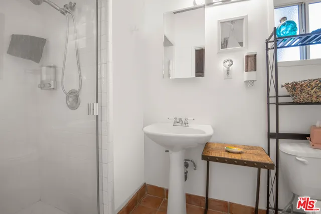 a view of a lush green hillside and houses