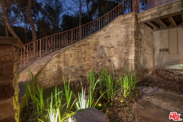 a view of an entryway with a door and chair