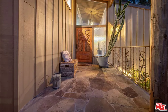 a view of a hallway with seating area