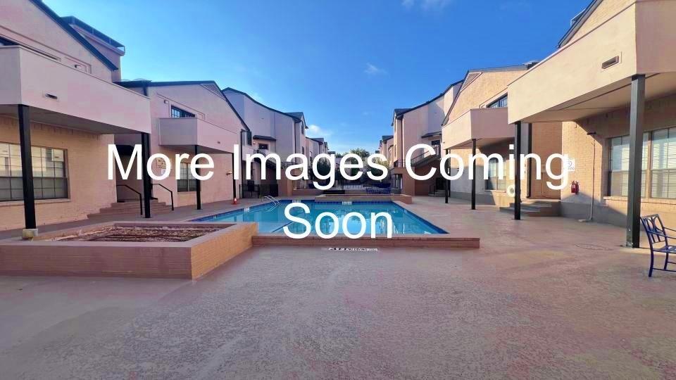 3901 Travis Street, Unit 217 Dallas, TX 75204 - Photo 2 of 2 a view of a street with houses