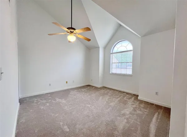 a view of a chandelier fan in a room