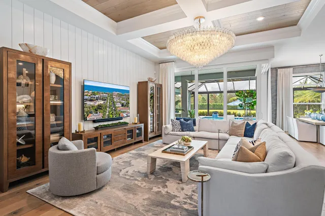 a dining hall with stainless steel appliances granite countertop a stove and a refrigerator