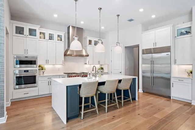 a spacious bedroom with a bed and a large window
