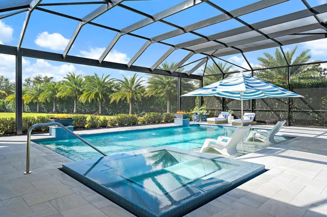 a view of a table and chairs under an umbrella