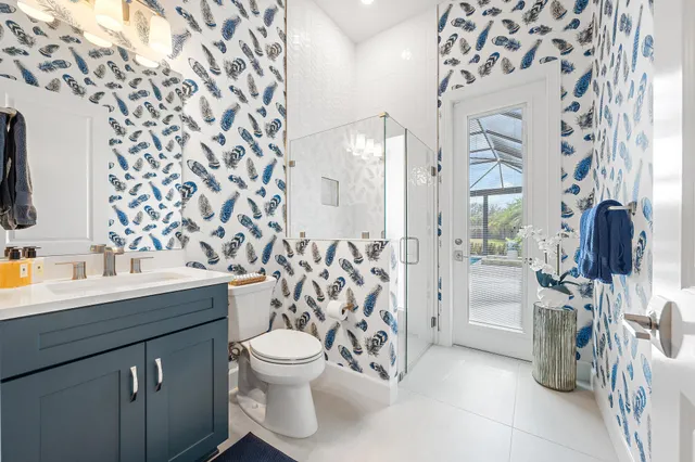 a en suite bathroom with double sink and a mirror