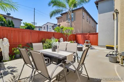 a view of a backyard with sitting area