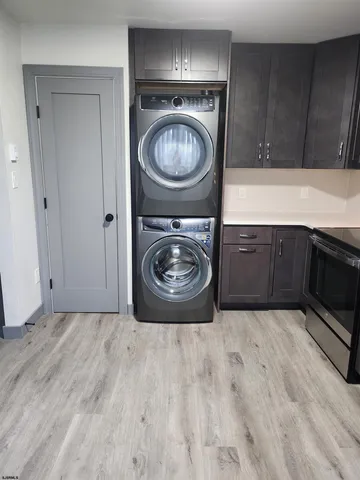 a utility room with washing machine and a sink