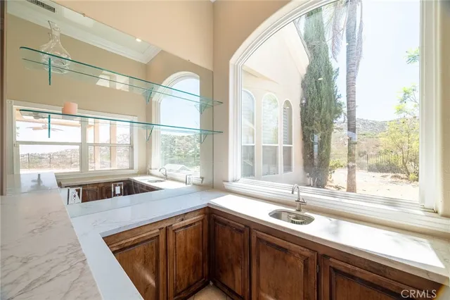 a kitchen with stainless steel appliances granite countertop a refrigerator sink and cabinets
