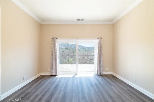 a view of a large mountain with mountains in the background