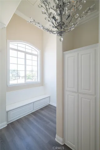 an aerial view of a house with a yard lake and mountain view in back