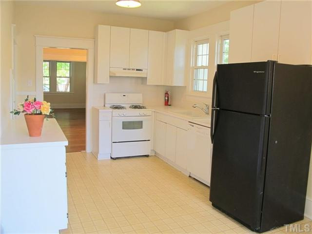 307 Perry Street Raleigh, NC 27608 - Photo 5 of 11 Cheerful kitchen, abounding in sunlight, provides informal dining as well as good kitchen and counter space with updated appliances. Kitchen