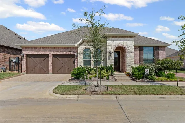 a front view of a house with yard
