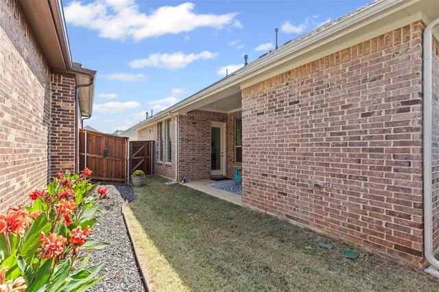 a backyard of a house with outdoor seating