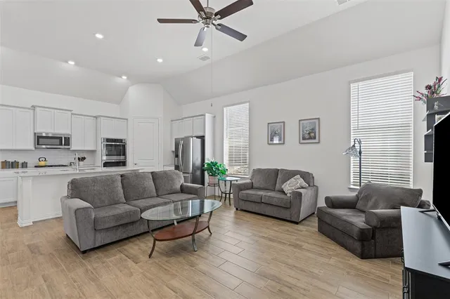 a view of a patio with table and chairs and potted plants