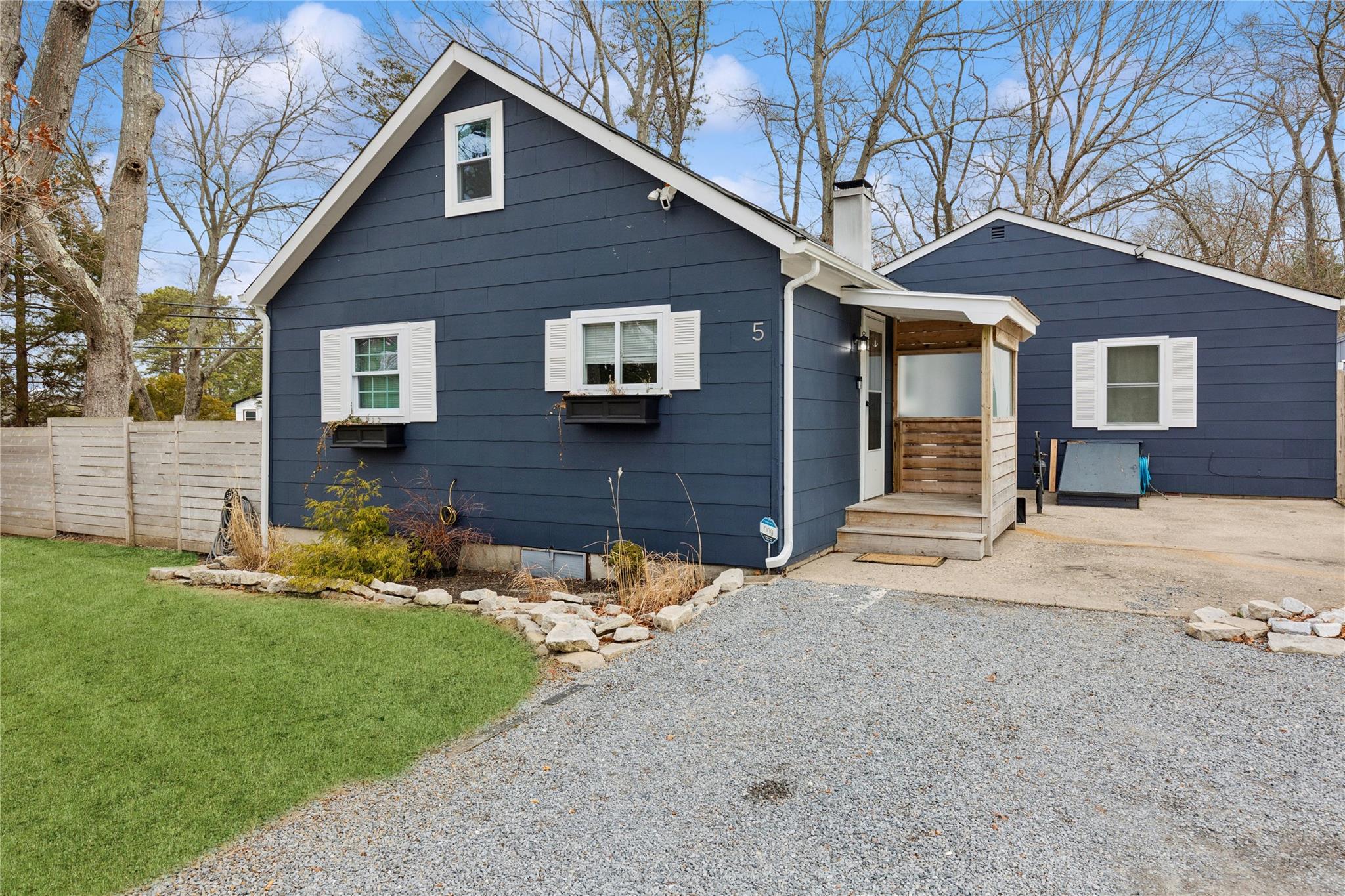 5 Sunset Trail Ridge, NY 11961 - Photo 1 of 1 View of front of property featuring a chimney, a front lawn, and fence