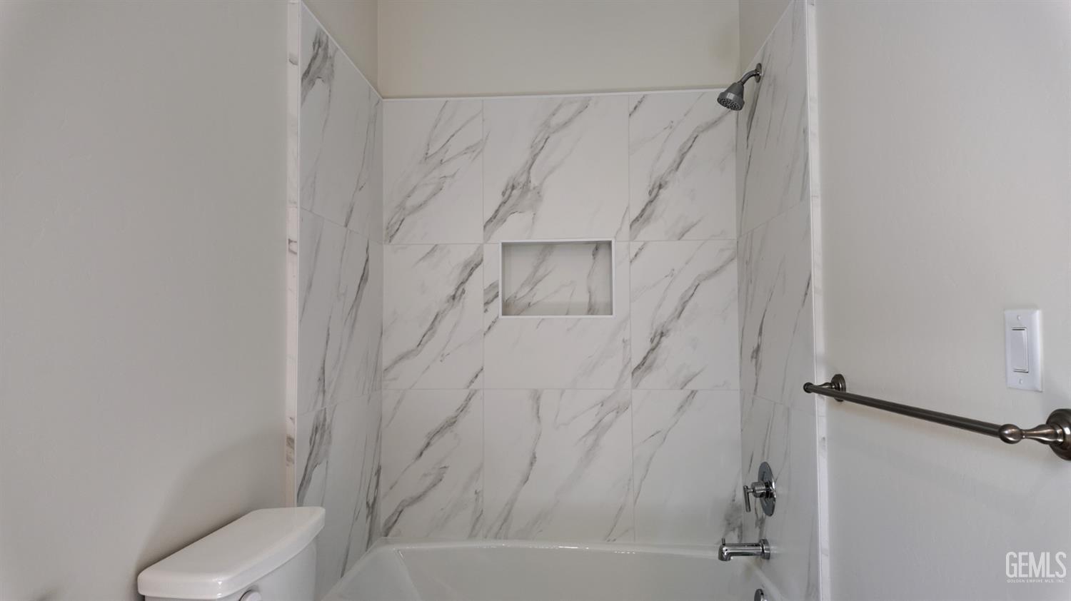 Undisclosed Address Bakersfield, CA 93311 - Photo 11 of 31 a bathroom with a shower and toilet