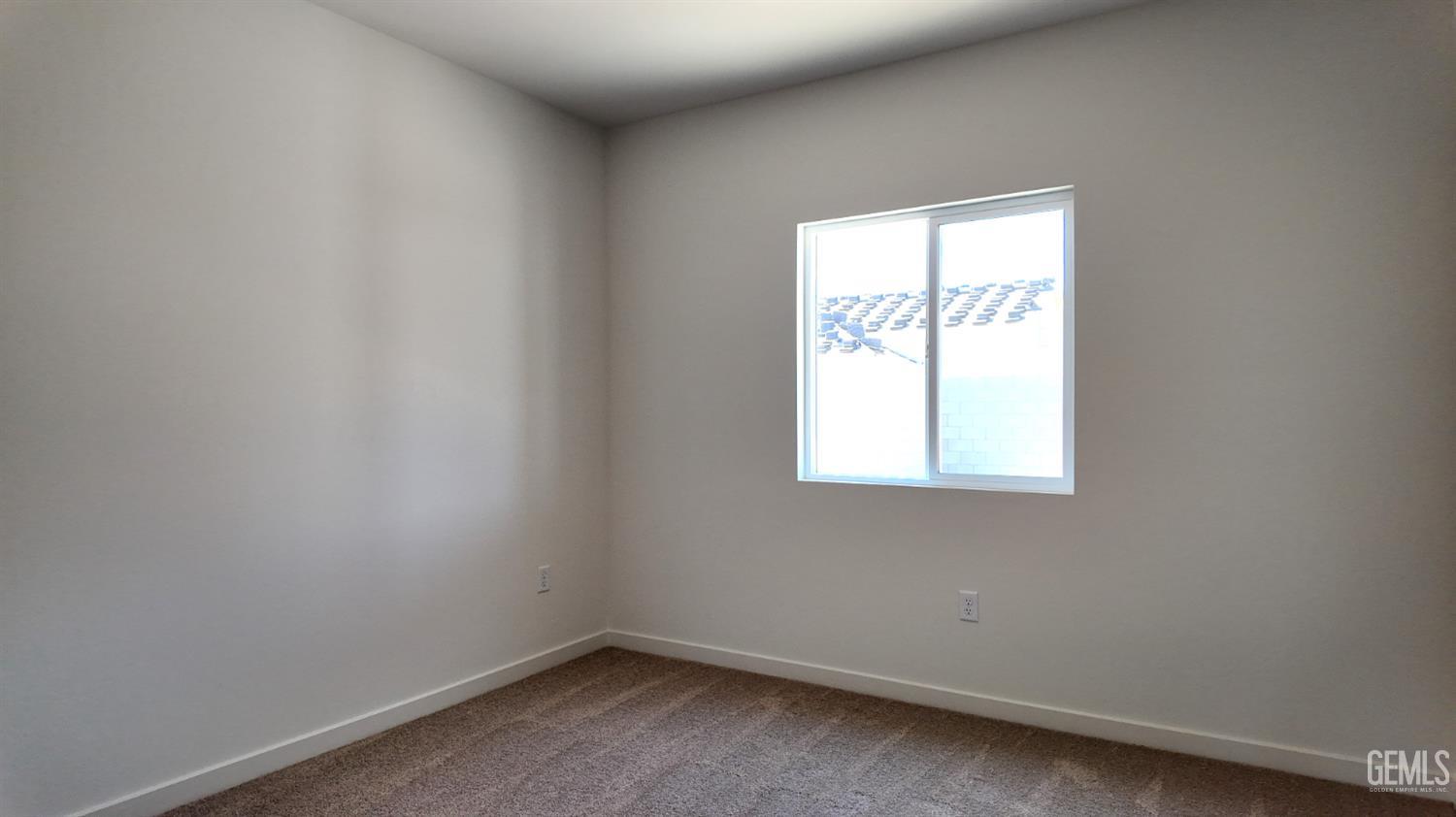 Undisclosed Address Bakersfield, CA 93311 - Photo 12 of 31 an empty room with a window
