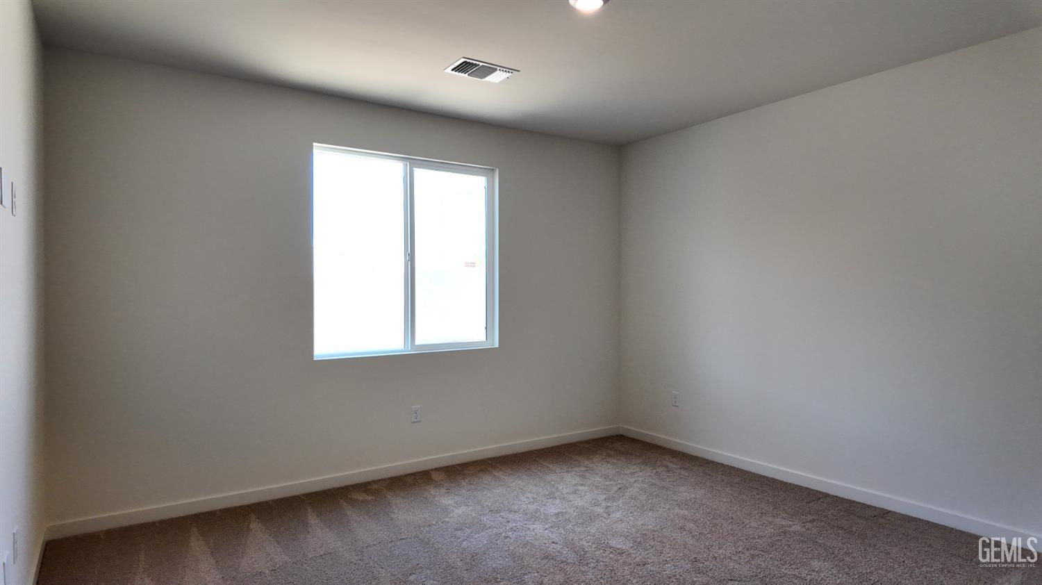 Undisclosed Address Bakersfield, CA 93311 - Photo 13 of 31 an empty room with a window