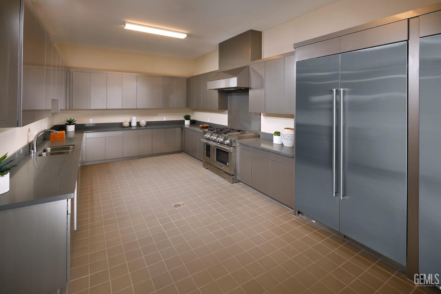 Undisclosed Address Bakersfield, CA 93311 - Photo 19 of 31 a kitchen with stainless steel appliances a refrigerator and a stove top oven