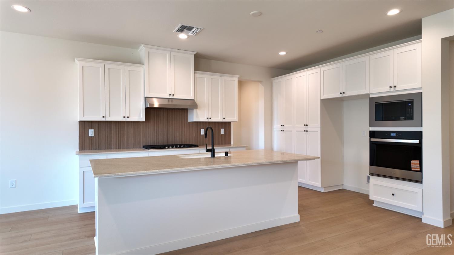 Undisclosed Address Bakersfield, CA 93311 - Photo 3 of 31 a kitchen with stainless steel appliances granite countertop a sink and a refrigerator