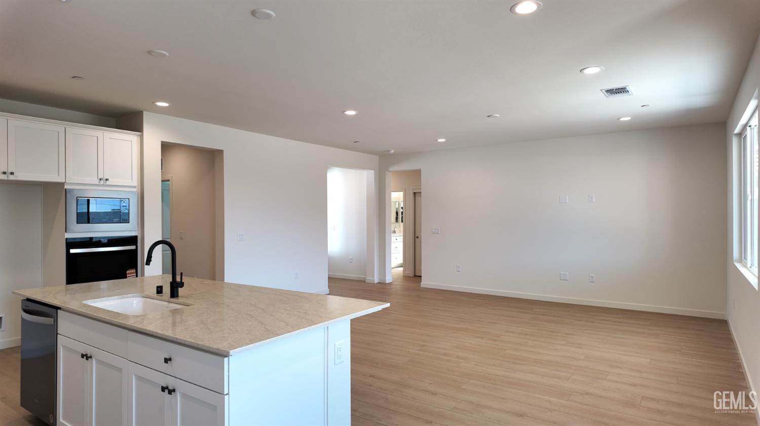 Undisclosed Address Bakersfield, CA 93311 - Photo 5 of 31 a kitchen with a sink and cabinets