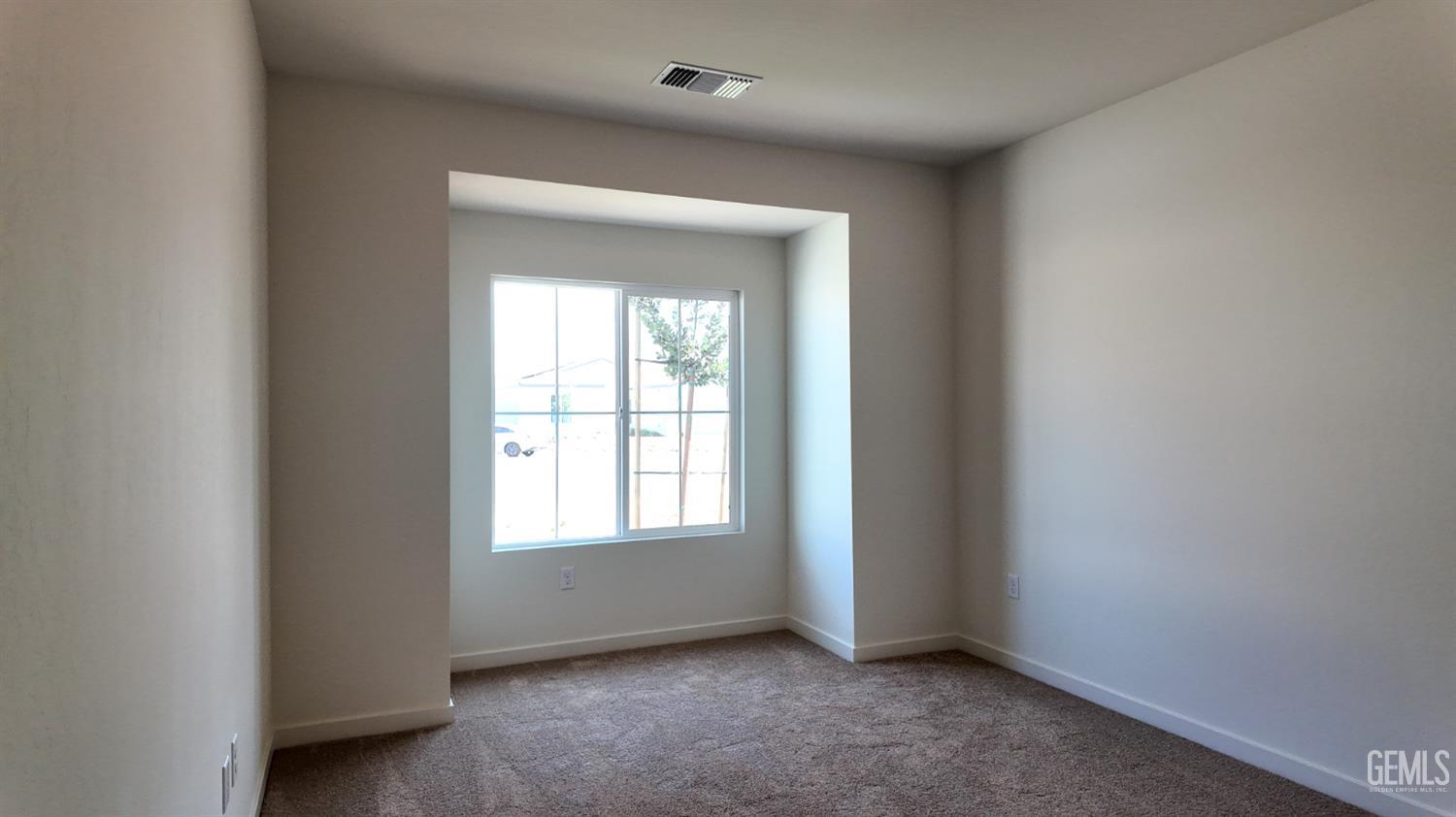 Undisclosed Address Bakersfield, CA 93311 - Photo 9 of 31 an empty room with a window