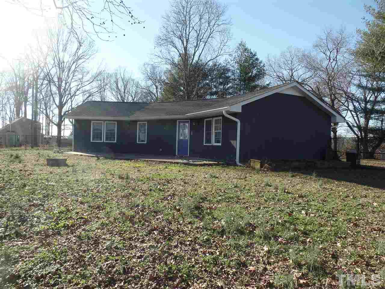 6617 Cassam Road Bahama, NC 27503 - Photo 2 of 20 Exterior back of the home with patio.