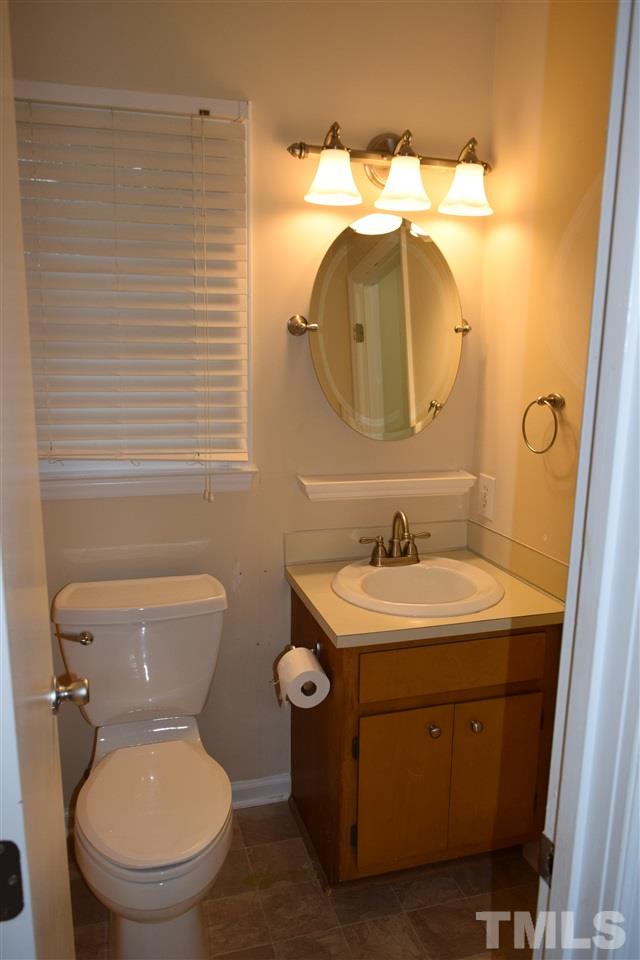 6617 Cassam Road Bahama, NC 27503 - Photo 12 of 20 The other full bath connects the bedroom with the laundry room.