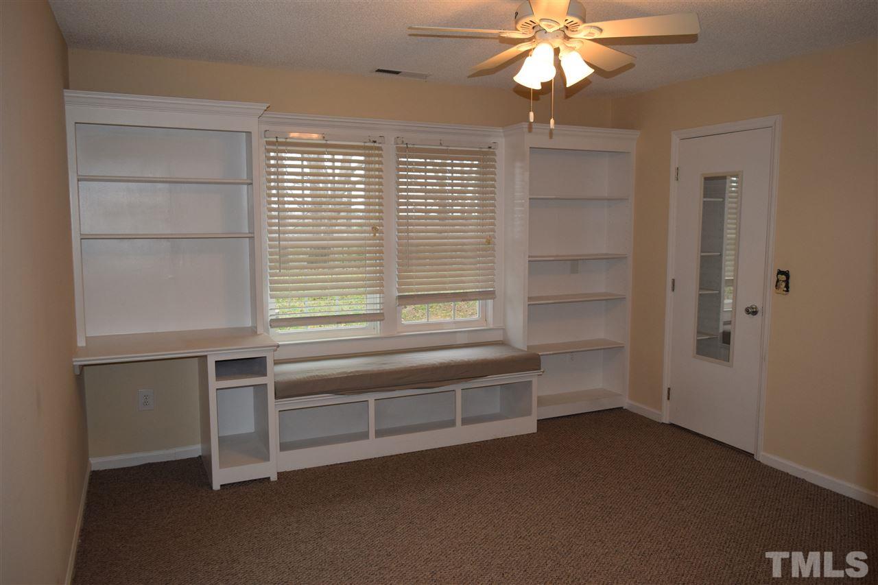 6617 Cassam Road Bahama, NC 27503 - Photo 13 of 20 The second bedroom has a built-in desk and lots of shelving.