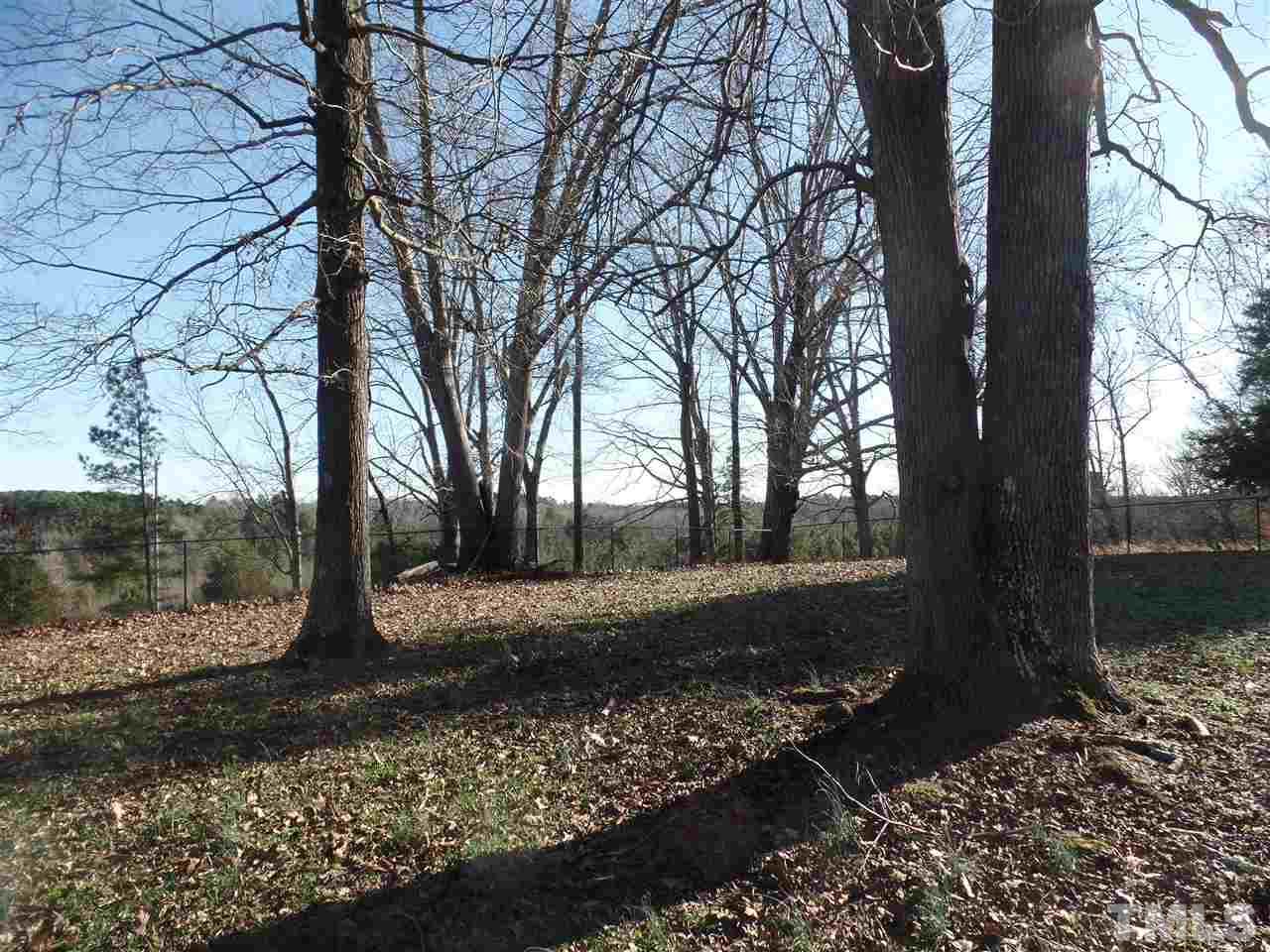 6617 Cassam Road Bahama, NC 27503 - Photo 19 of 20 The large fenced area also has some beautiful mature trees for shade.