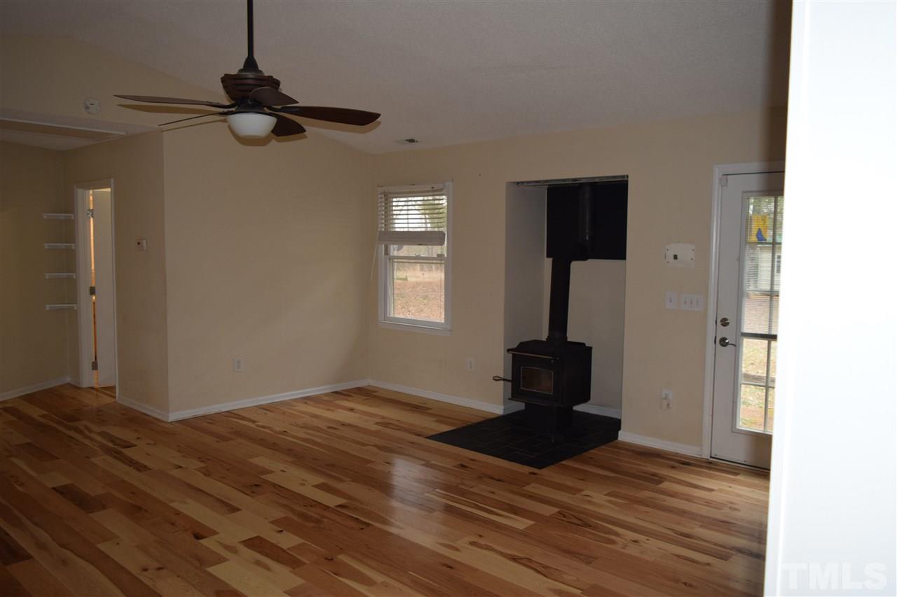 6617 Cassam Road Bahama, NC 27503 - Photo 4 of 20 Wood stove in great room allows for wood heating if power is out--or just to supplement heating.