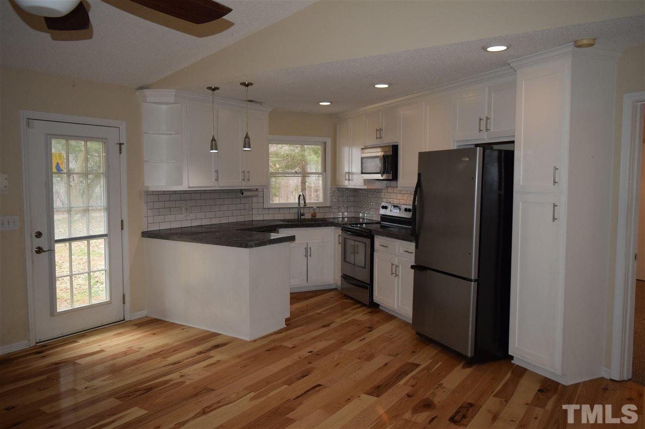 6617 Cassam Road Bahama, NC 27503 - Photo 7 of 20 There is ample cabinet storage and a pantry cupboard.