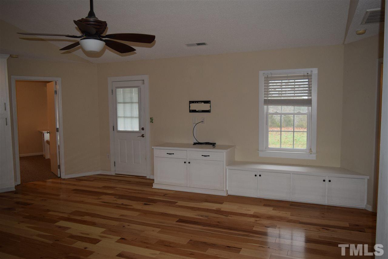 6617 Cassam Road Bahama, NC 27503 - Photo 8 of 20 The built-in cabinets offer great storage opportunities and there is a bracket affixed for TV.