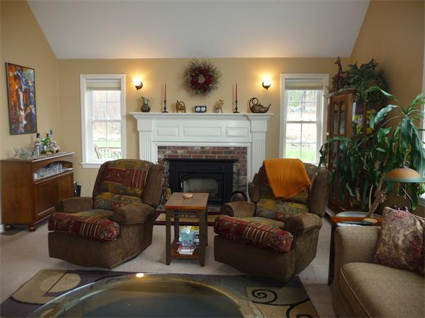 89 North End Road Townsend, MA 01469 - Photo 8 of 19 a living room with furniture and a fireplace