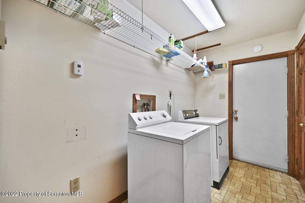 2181 Becks Crossing Road Moscow, PA 18444 - Photo 23 of 70 a bathroom with a sink a mirror and a shower