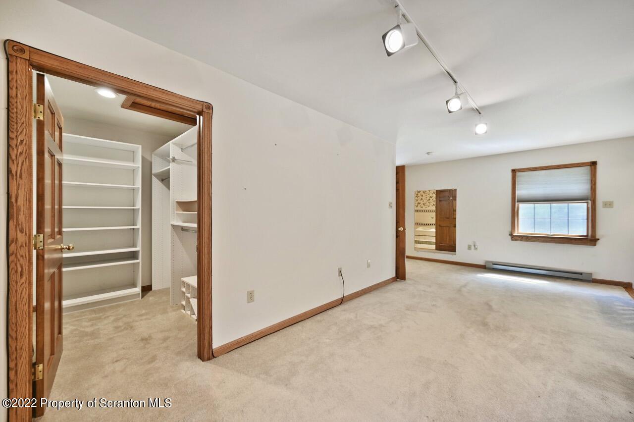 2181 Becks Crossing Road Moscow, PA 18444 - Photo 30 of 70 an empty room with closet and windows
