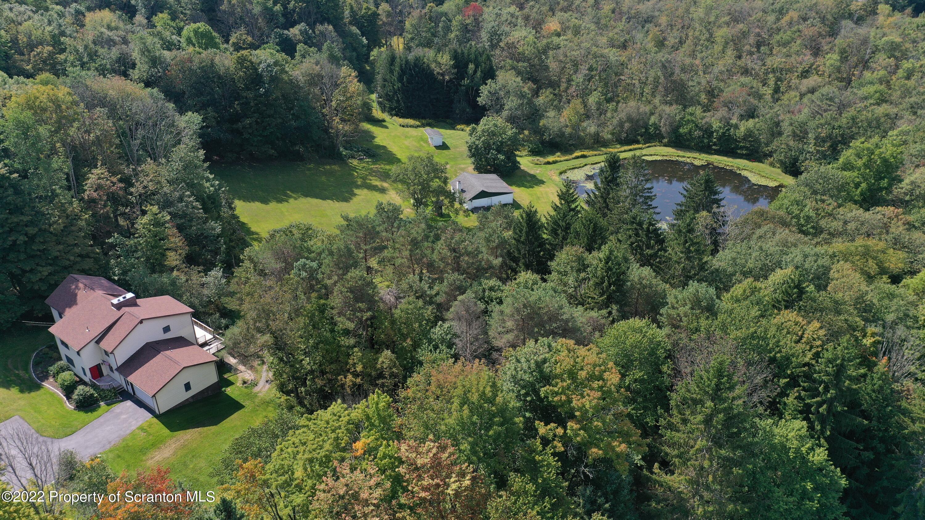 2181 Becks Crossing Road Moscow, PA 18444 - Photo 67 of 70 an aerial view of a house with a yard and lake view