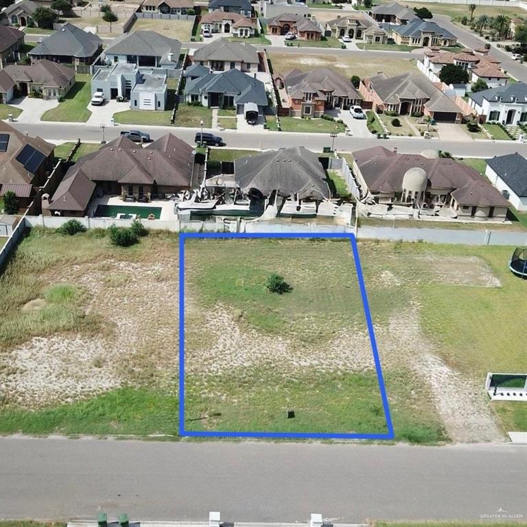 Aerial view of residential area with property boundaries highlighted