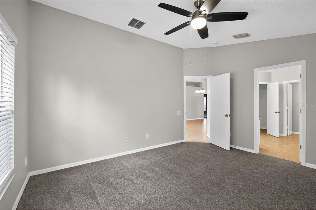 12630 Early Run Lane Riverview, FL 33578 - Photo 9 of 14 a view of an empty room with a window