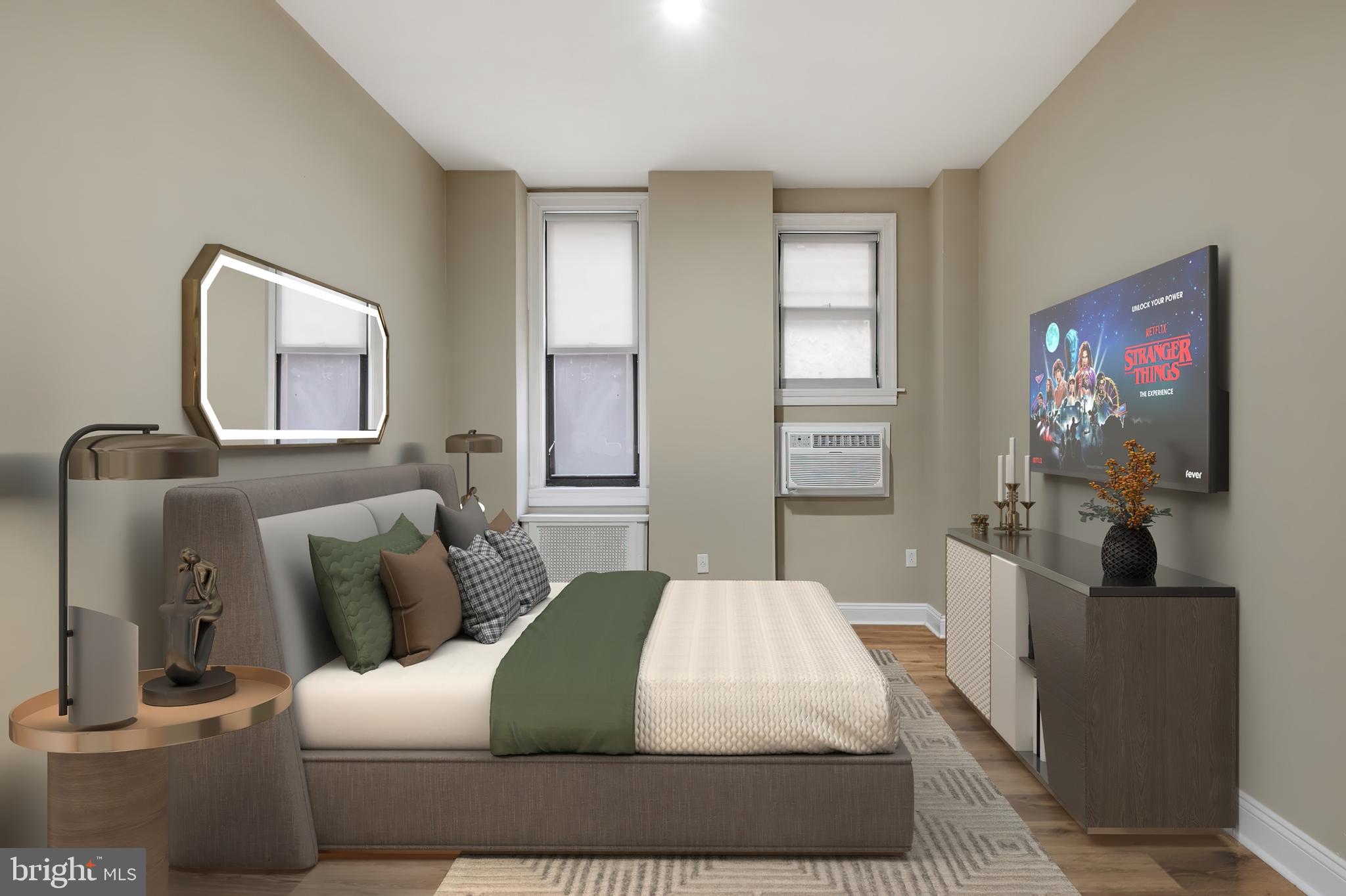 1218 Walnut Street, Unit 402 Philadelphia, PA 19107 - Photo 3 of 17 a bedroom with a bed and a couch