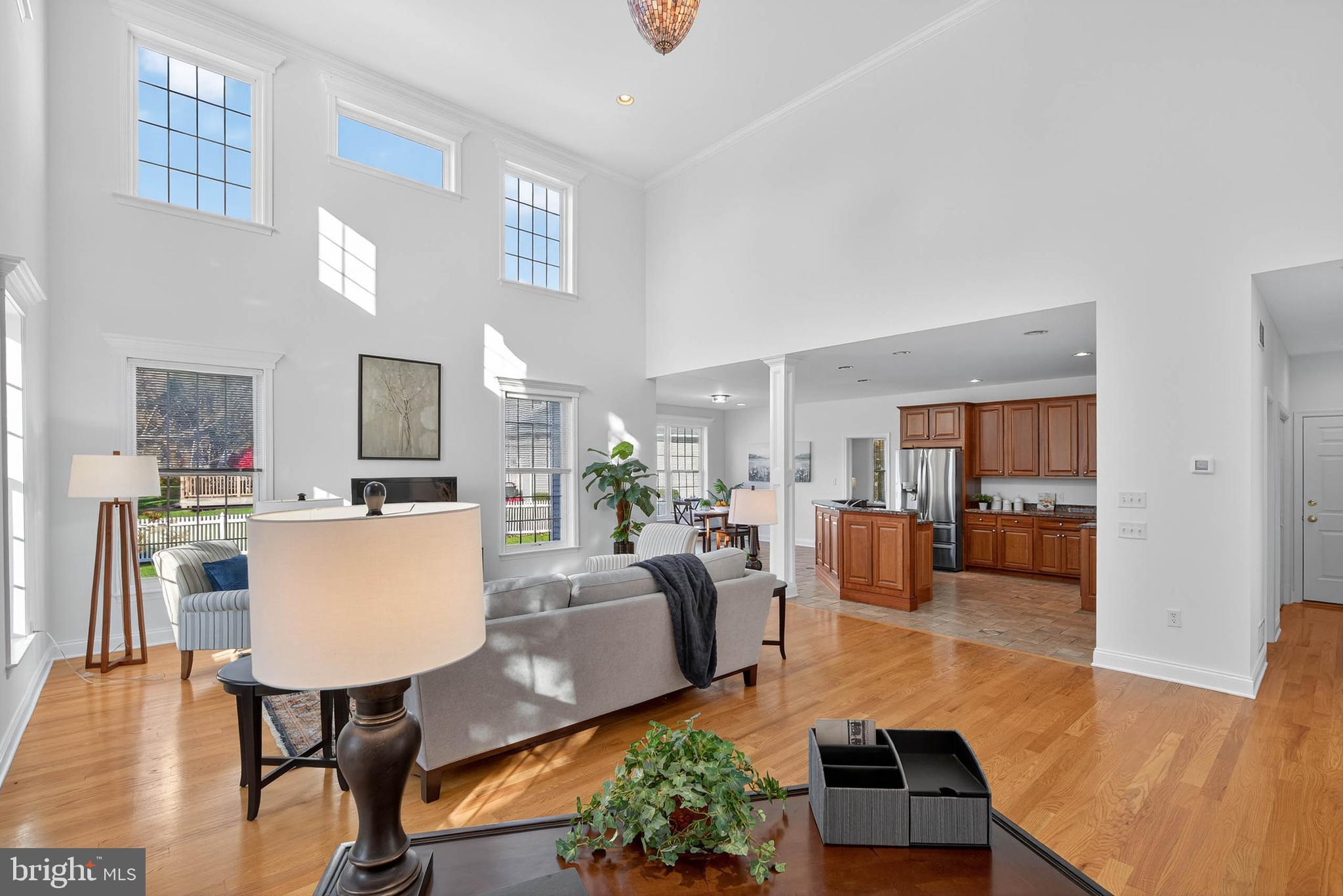 304 Cobblers Court Lititz, PA 17543 - Photo 11 of 50 a living room with furniture kitchen view and a wooden floor