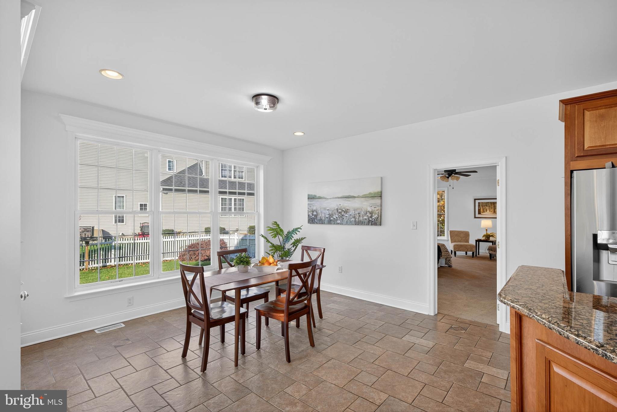 304 Cobblers Court Lititz, PA 17543 - Photo 15 of 50 a view of a dining room with furniture and a potted plant