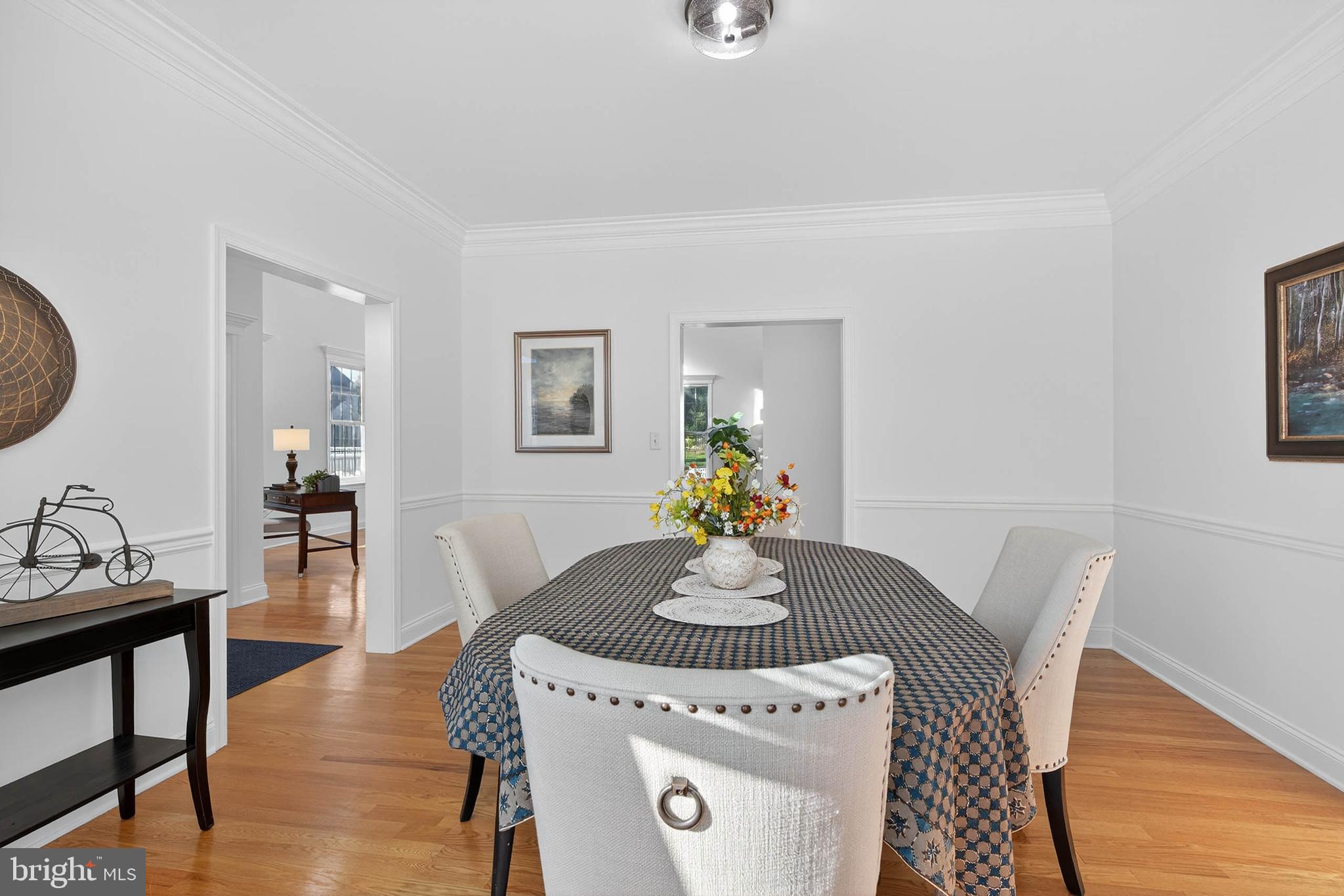 304 Cobblers Court Lititz, PA 17543 - Photo 18 of 50 a dining room with furniture and wooden floor