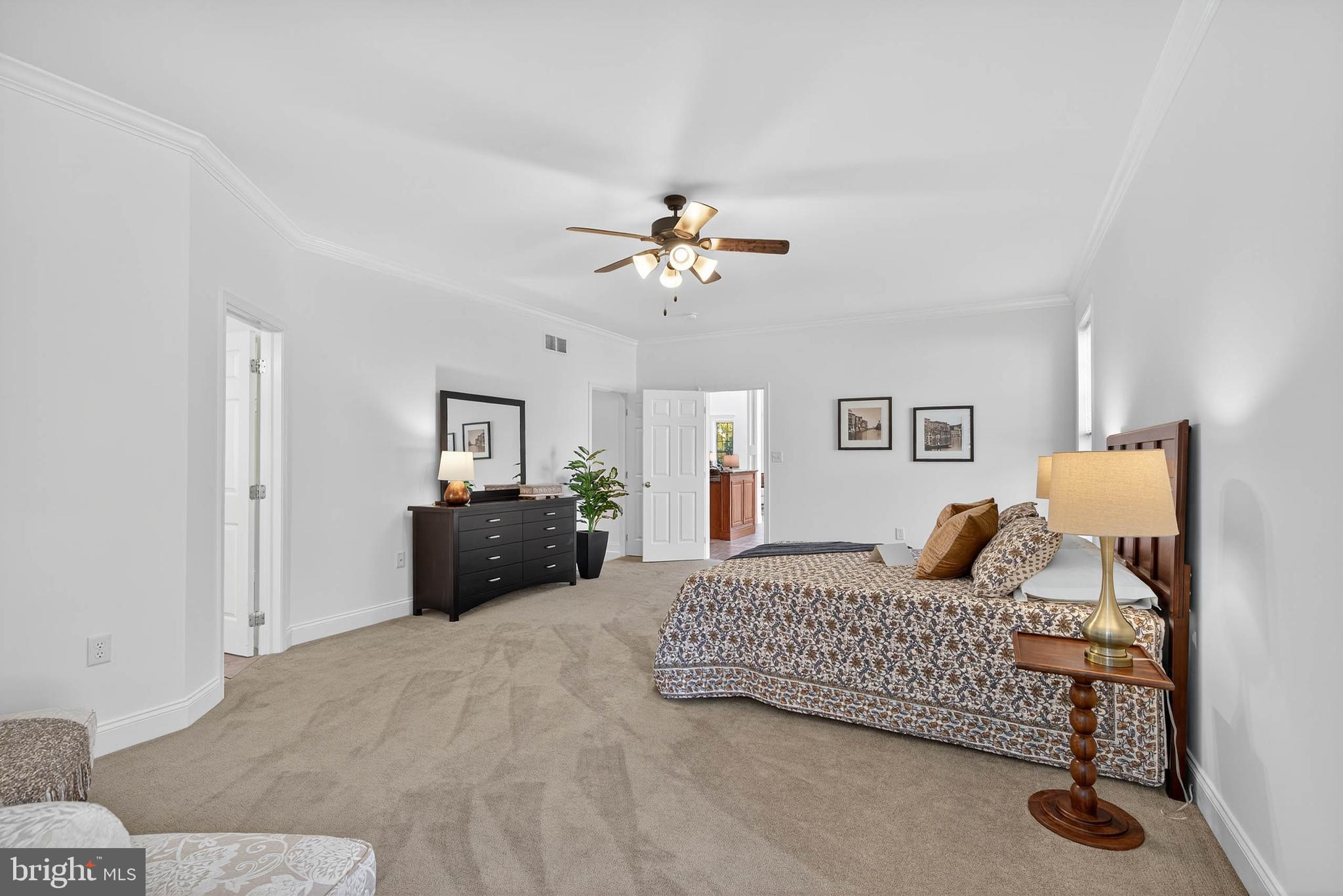 304 Cobblers Court Lititz, PA 17543 - Photo 21 of 50 a bedroom with a bed and a chandelier