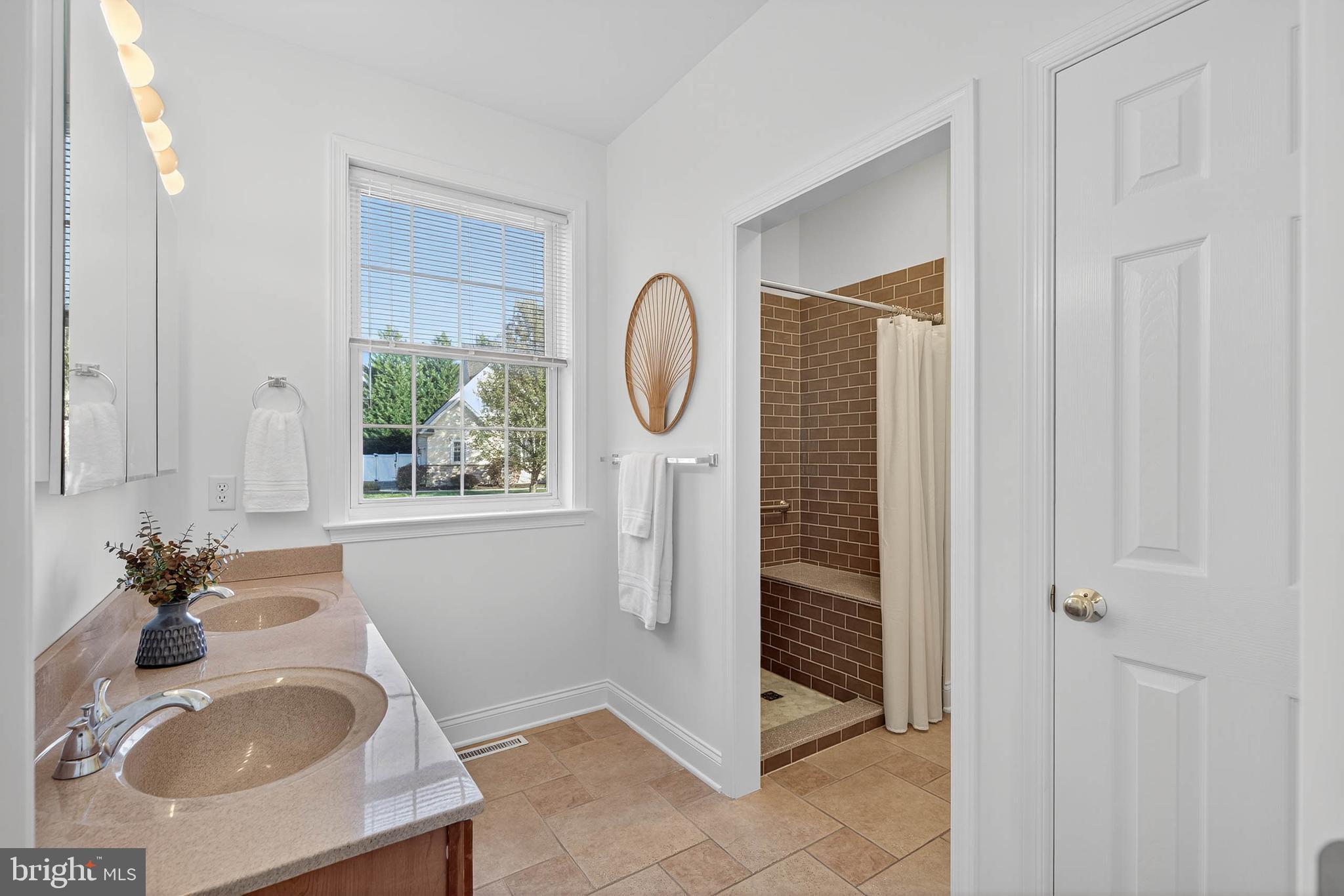 304 Cobblers Court Lititz, PA 17543 - Photo 22 of 50 a bathroom with a sink a toilet and a mirror