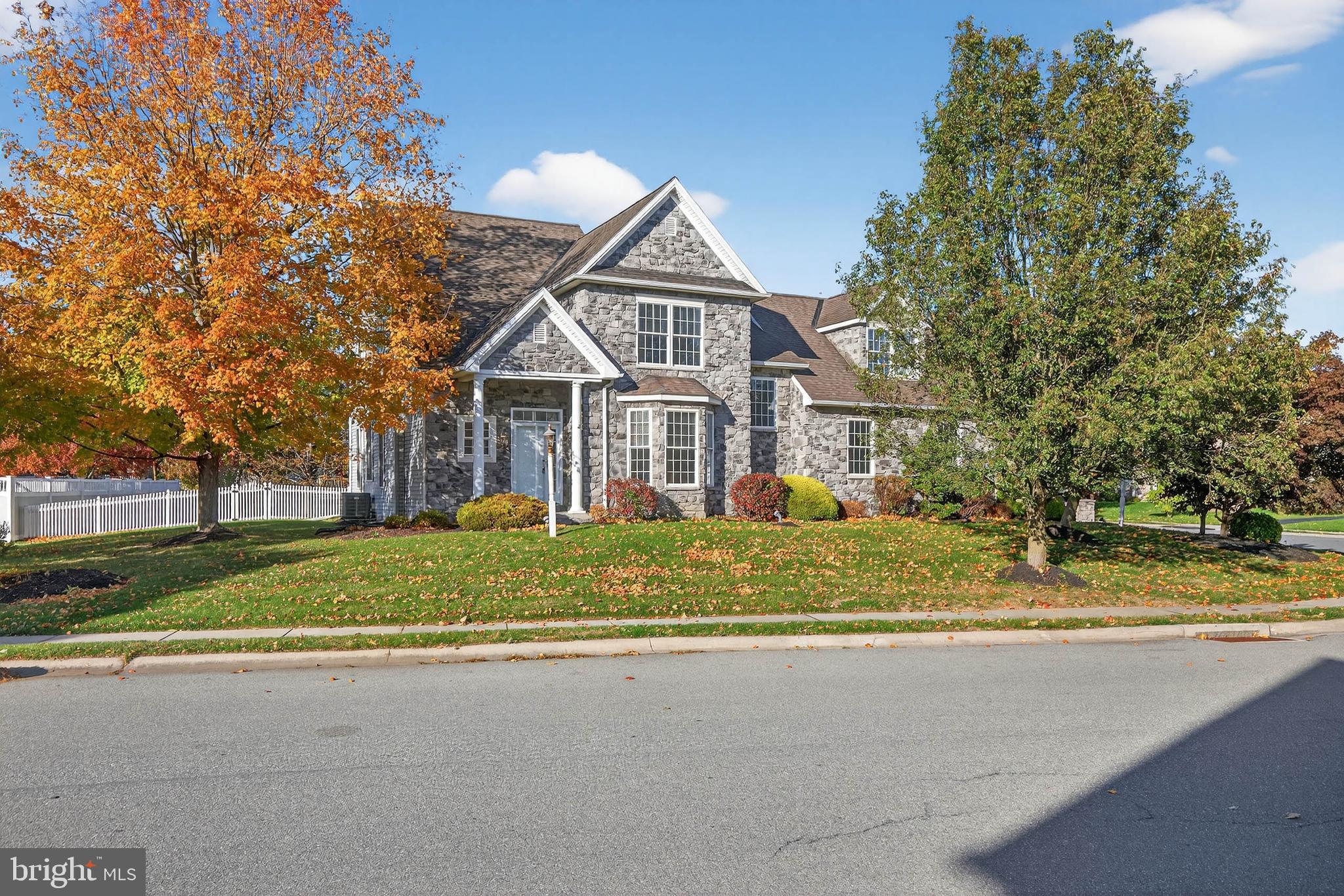 304 Cobblers Court Lititz, PA 17543 - Photo 42 of 50 a view of a house next to a yard with big trees