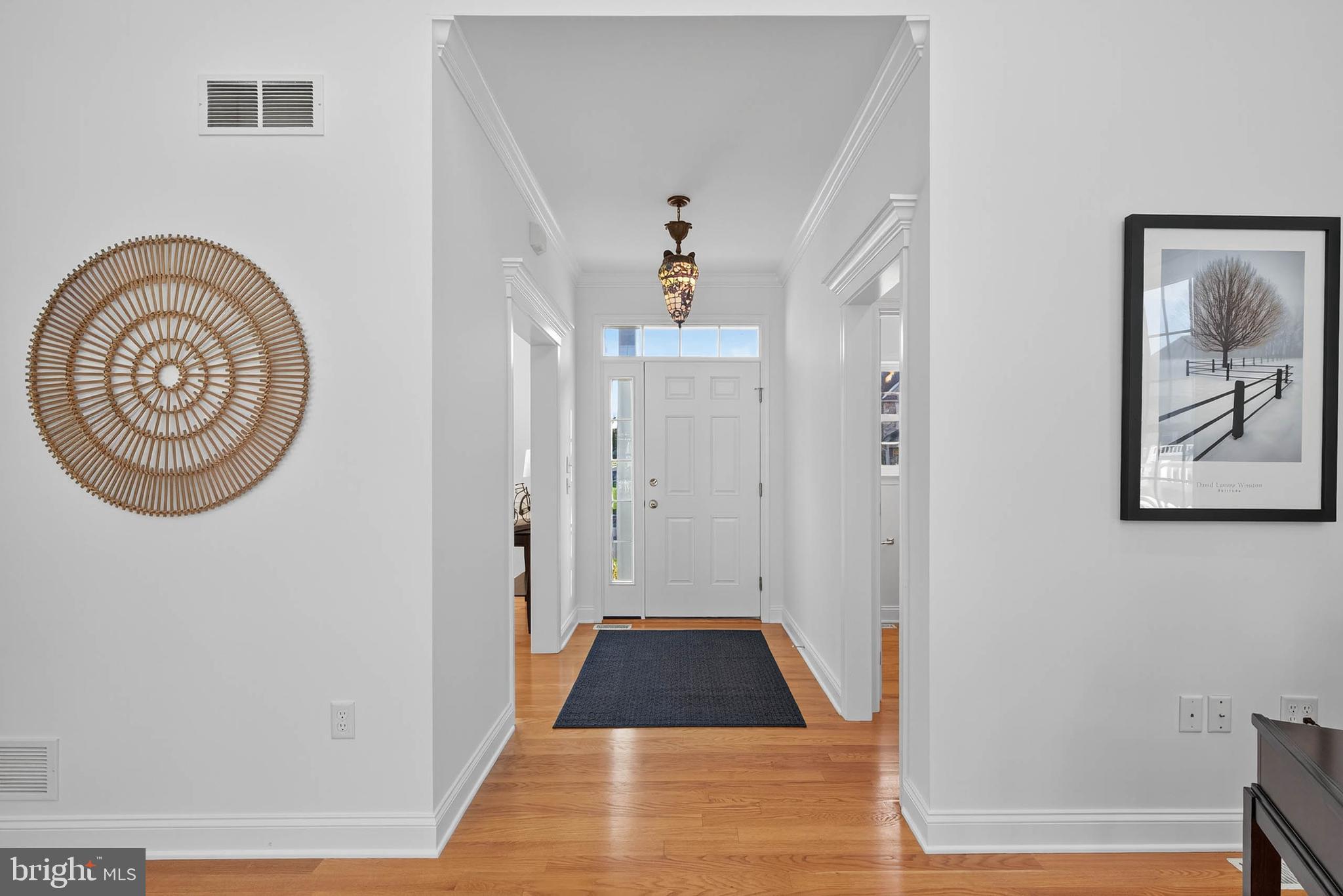 304 Cobblers Court Lititz, PA 17543 - Photo 6 of 50 a view of a hallway with wooden floor