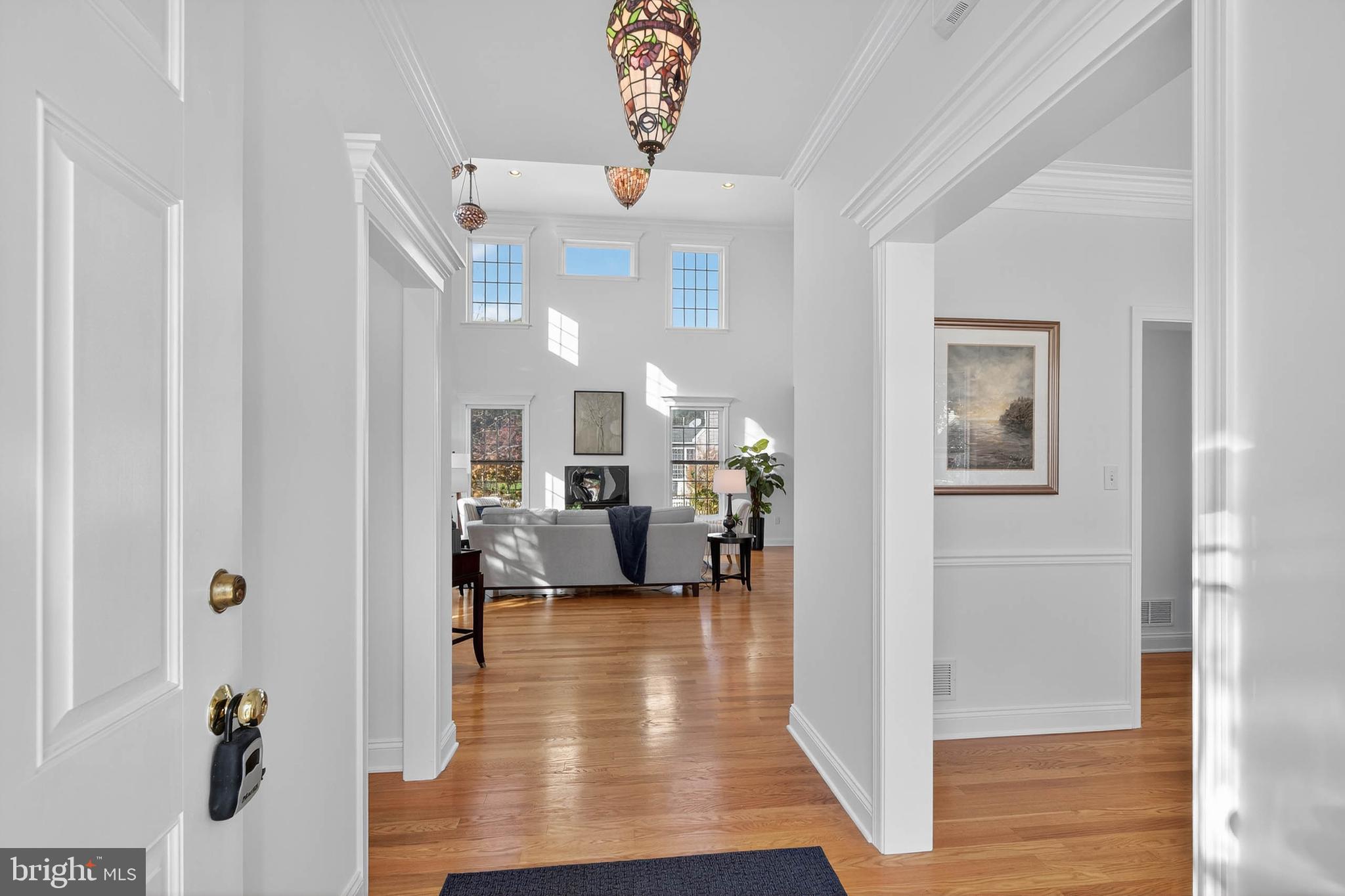 304 Cobblers Court Lititz, PA 17543 - Photo 7 of 50 a view of a livingroom with furniture hardwood floor and a ceiling fan